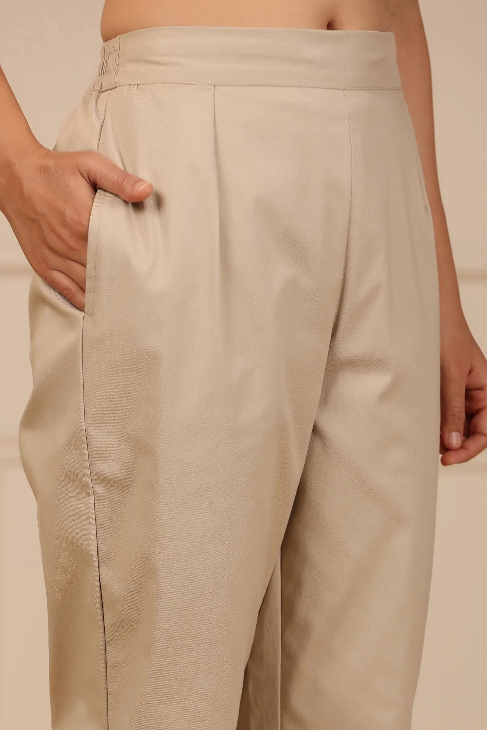 Jashvi Beige Spendex Solid Slim Fit Pants With Partially Elasticated Waistband